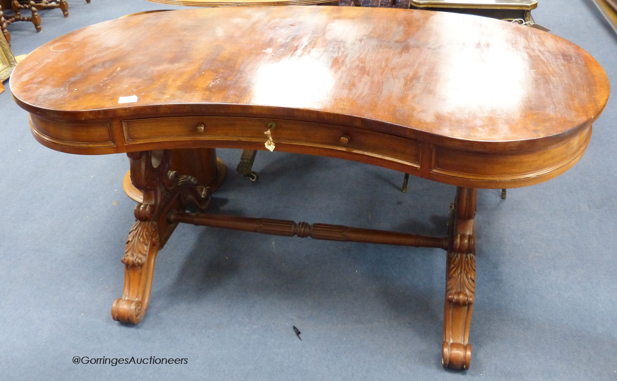 A William IV mahogany kidney shape table. W-150, D-180, H-72cm.